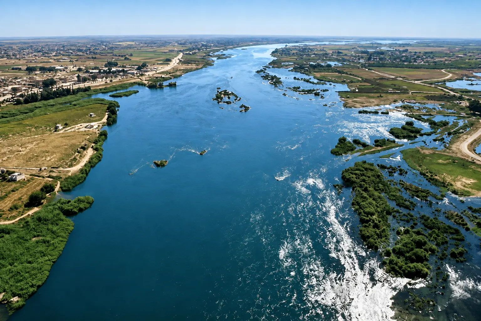 Aerial view of the Euphrates River flowing through Raqqa Governorate, Syria